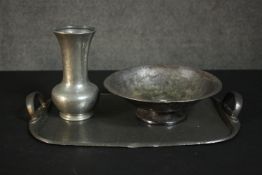 A collection of pewter ware, including a twin handled hammered effect pewter tray, a vase and bowl
