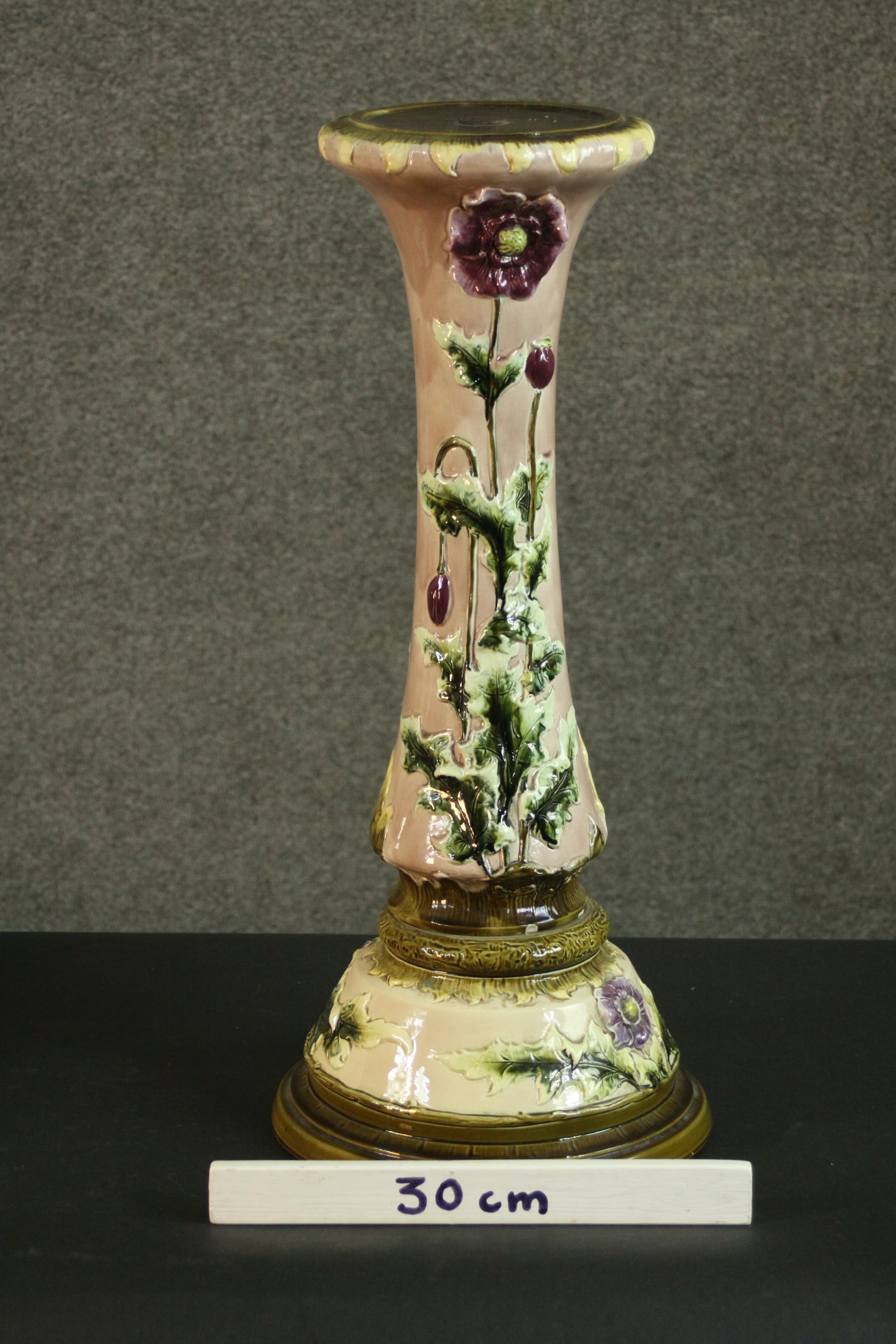 An early 20th century relief poppy design ceramic planter stand on cream ground and green detailing. - Image 2 of 6