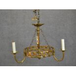 An Edwardian gilt metal three branch chandelier with foliate design and acanthus finial. H.42 Diam.