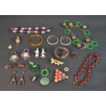 A collection of costume jewellery including an amethyst and rose quartz bead necklace, Bakelite jade