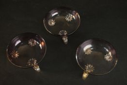 Three Murano style purple glass handled dishes. H.4 Dia.10cm.