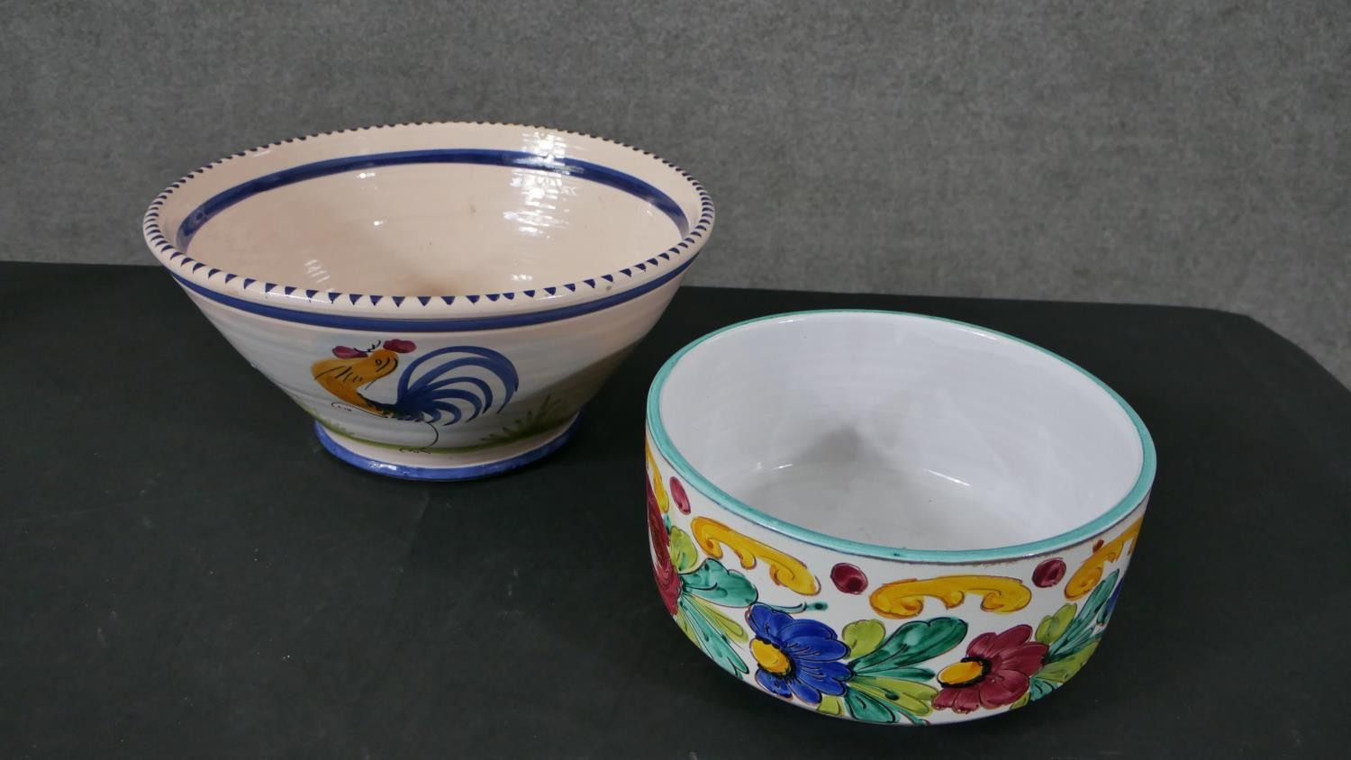 A large Portuguese hand painted ceramic rooster bowl along with a Majolica floral design bowl. D.