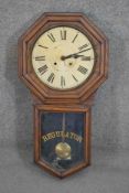 An early 20th century Oak cased "REGULATOR" wall clock, by Waterbury Clock Co., USA, enamel dial and