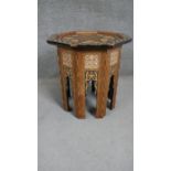 A Middle Eastern occasional table, the octagonal mother of pearl and marquetry inlaid top over