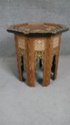 A Middle Eastern occasional table, the octagonal mother of pearl and marquetry inlaid top over