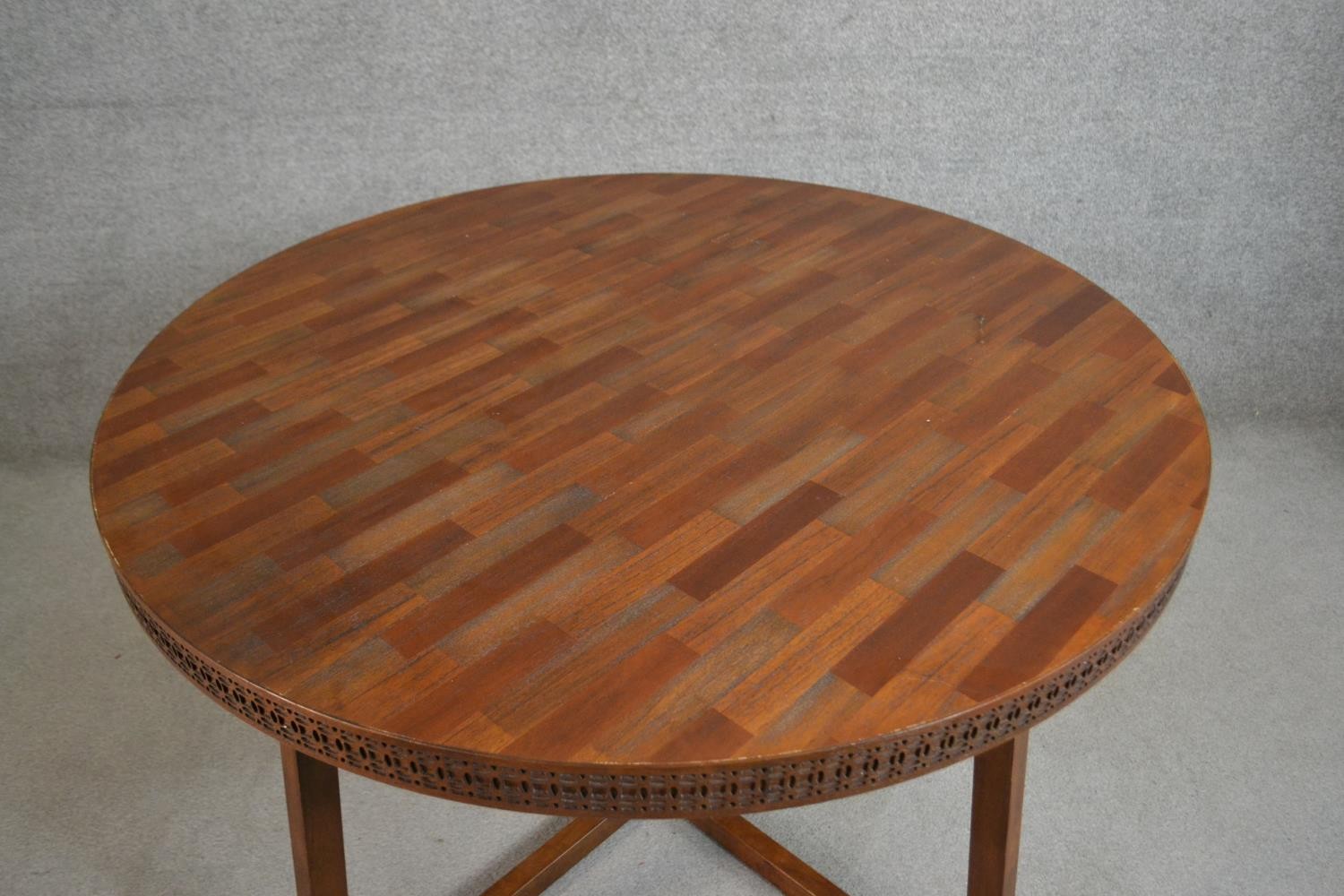 A contemporary circular hardwood dining table, the parquetry top with a blind fret edge on splayed - Image 2 of 6