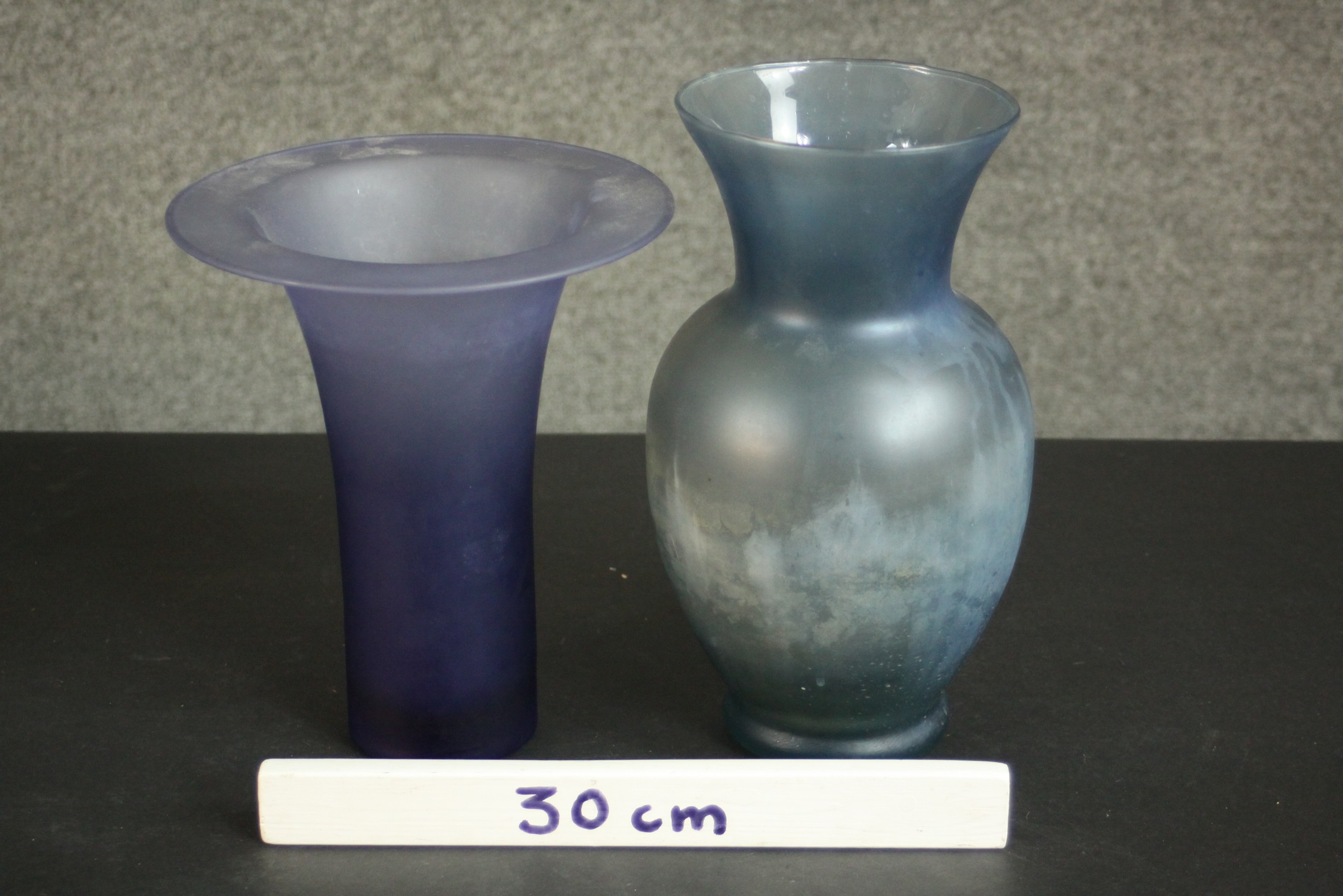 Two blue lustre art glass vases one with a trumpeting design. H.29 Dia.15cm. - Image 2 of 4