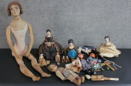 A collection of early 20th century dolls, including nine hand painted jointed Grodnertal style