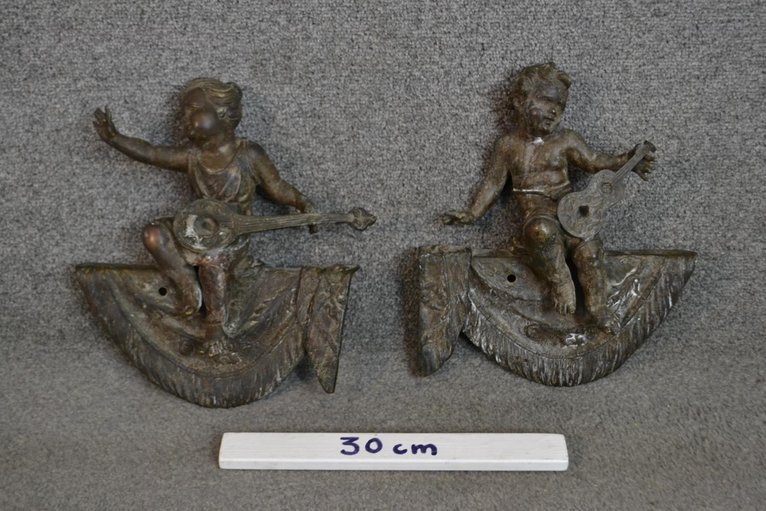 A pair of 19th century bronze finials in the form of putti musicians on swags. H.32 W.27cm - Image 2 of 5