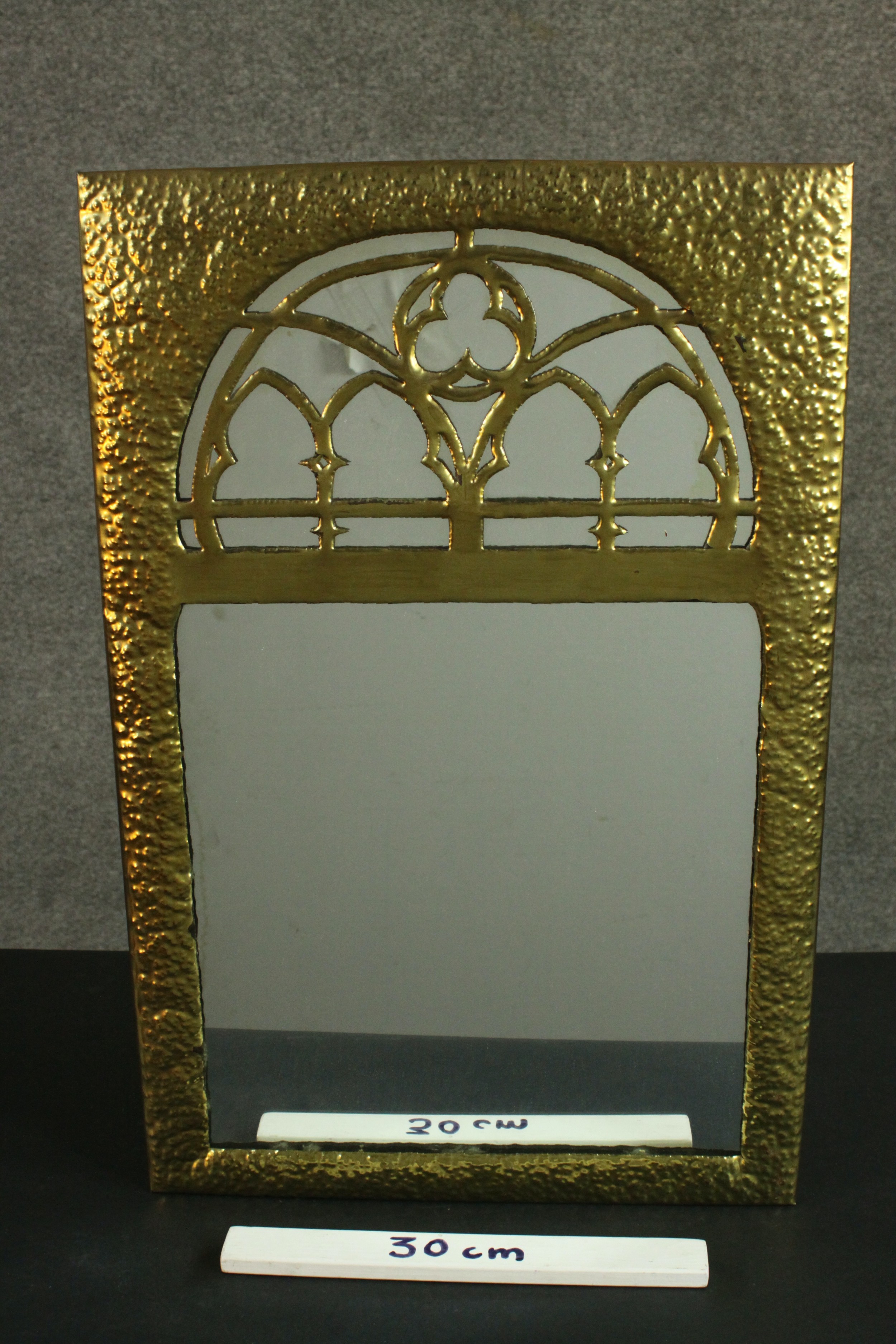 A Gothic Revival/Arts & Crafts planished brass framed mirror with gothic tracery to the rounded arch - Image 2 of 5