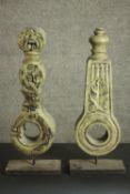 Two carved and painted architectural finials on stands. H.54 W.20 D.10cm.