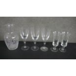A collection of six pieces of etched glassware, including a stylised foliate design carafe, a set of
