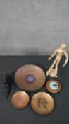 A collection of copper dishes along with an artist's beech articulated mannequin on stand. H.34cm