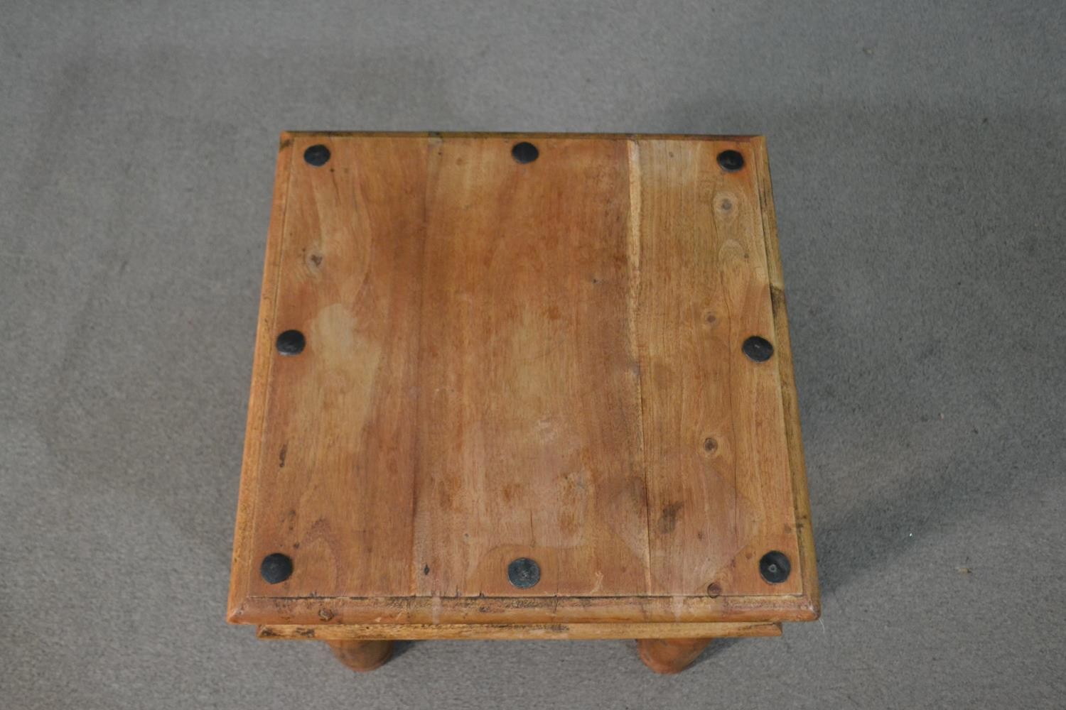 An Indian Sheesham occasional coffee table, the square top with iron studs, on turned legs with iron - Image 4 of 5