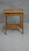 An Arts & Crafts oak occasional table, the rectangular top with a moulded edge over a single