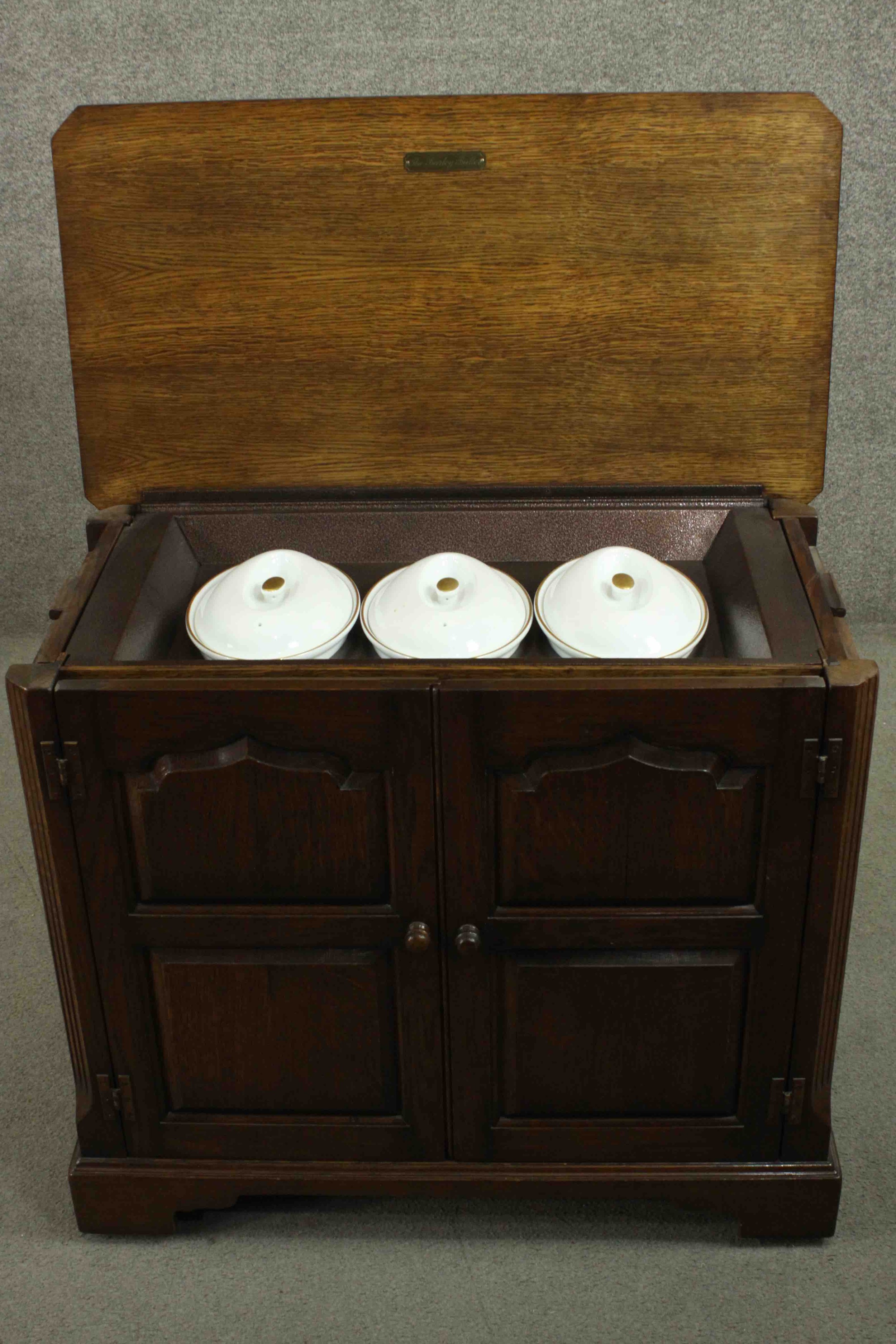 The Burley Butler; an oak heated sideboard electric food warmer, with a rising lid and two - Image 4 of 11