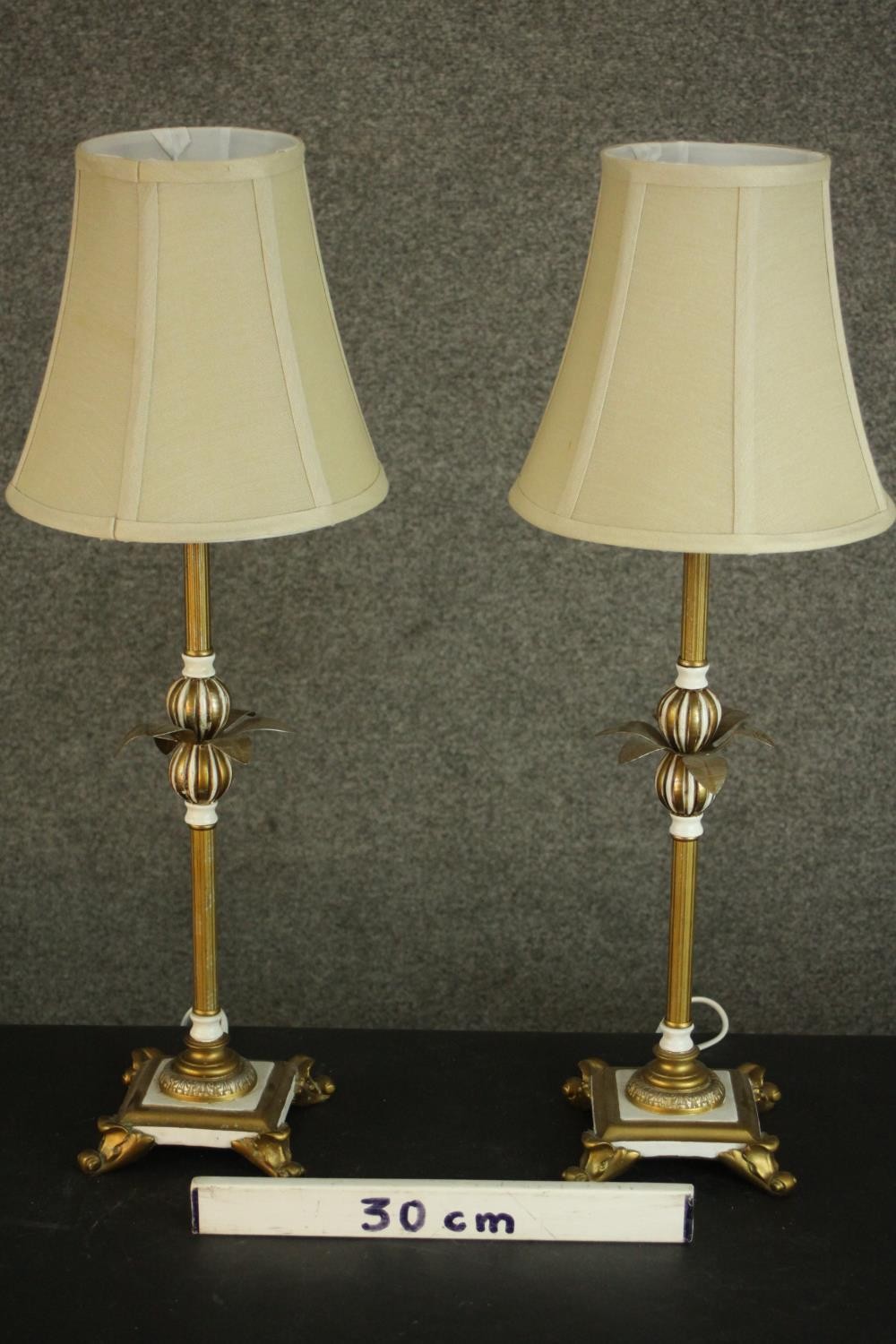 A pair of parcel gilt and white painted table lamps, with leaf detail, on four acanthus leaf feet, - Image 2 of 6