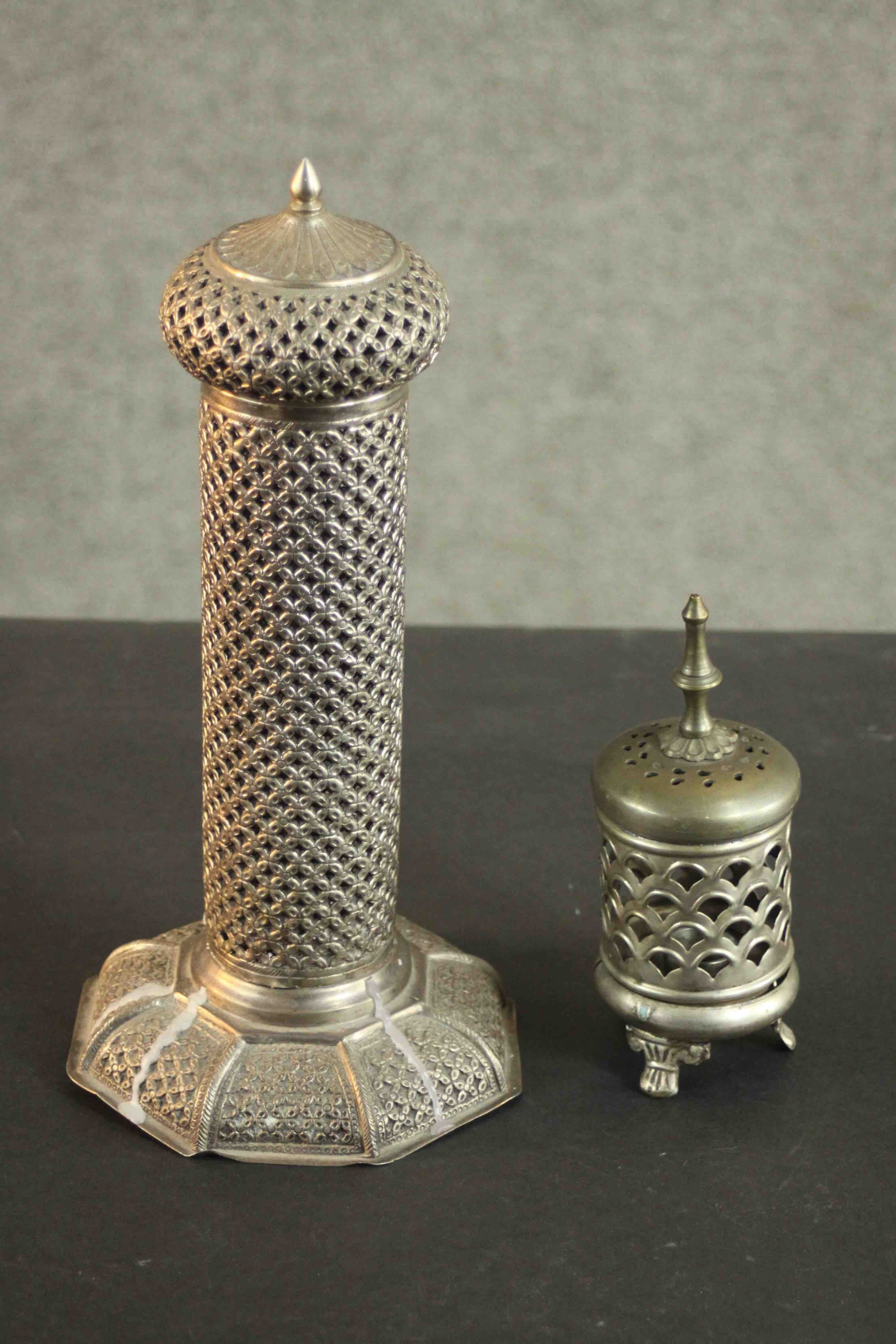 An Indian low grade silver pierced design candle holder with hexagonal base. Stamped silver (base