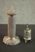 An Indian low grade silver pierced design candle holder with hexagonal base. Stamped silver (base