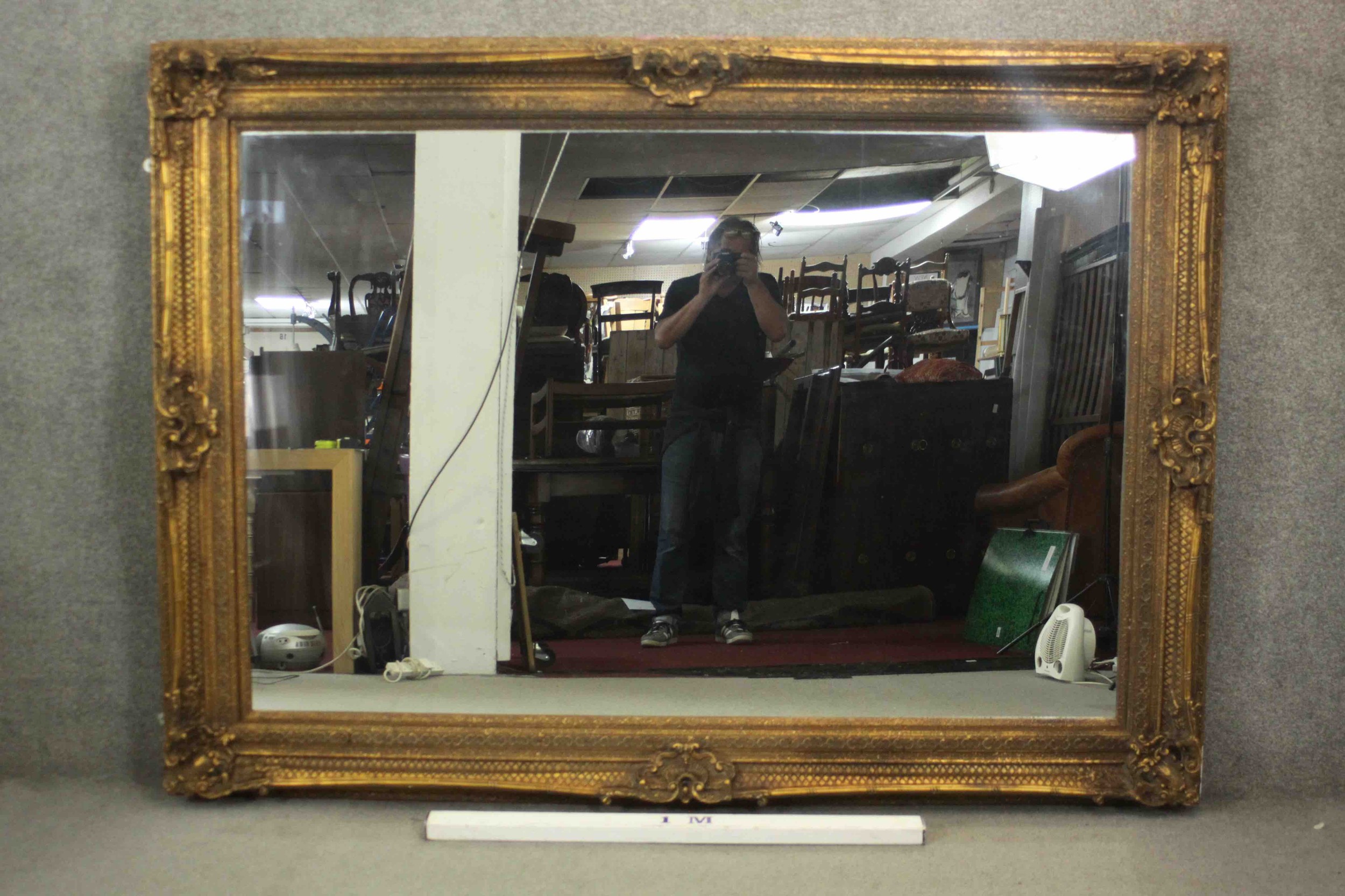 A large and decoratively framed gilt pier mirror in the Rococo style. H.160 W.220cm. - Image 2 of 9