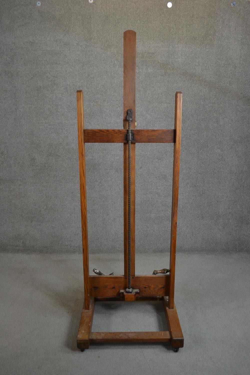A late 19th/early 20th century oak artist's studio easel, with winders for raising and lowering - Image 7 of 7