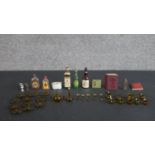 A collection of dolls house items and miniatures, including a set of hand-blown glass miniature wine