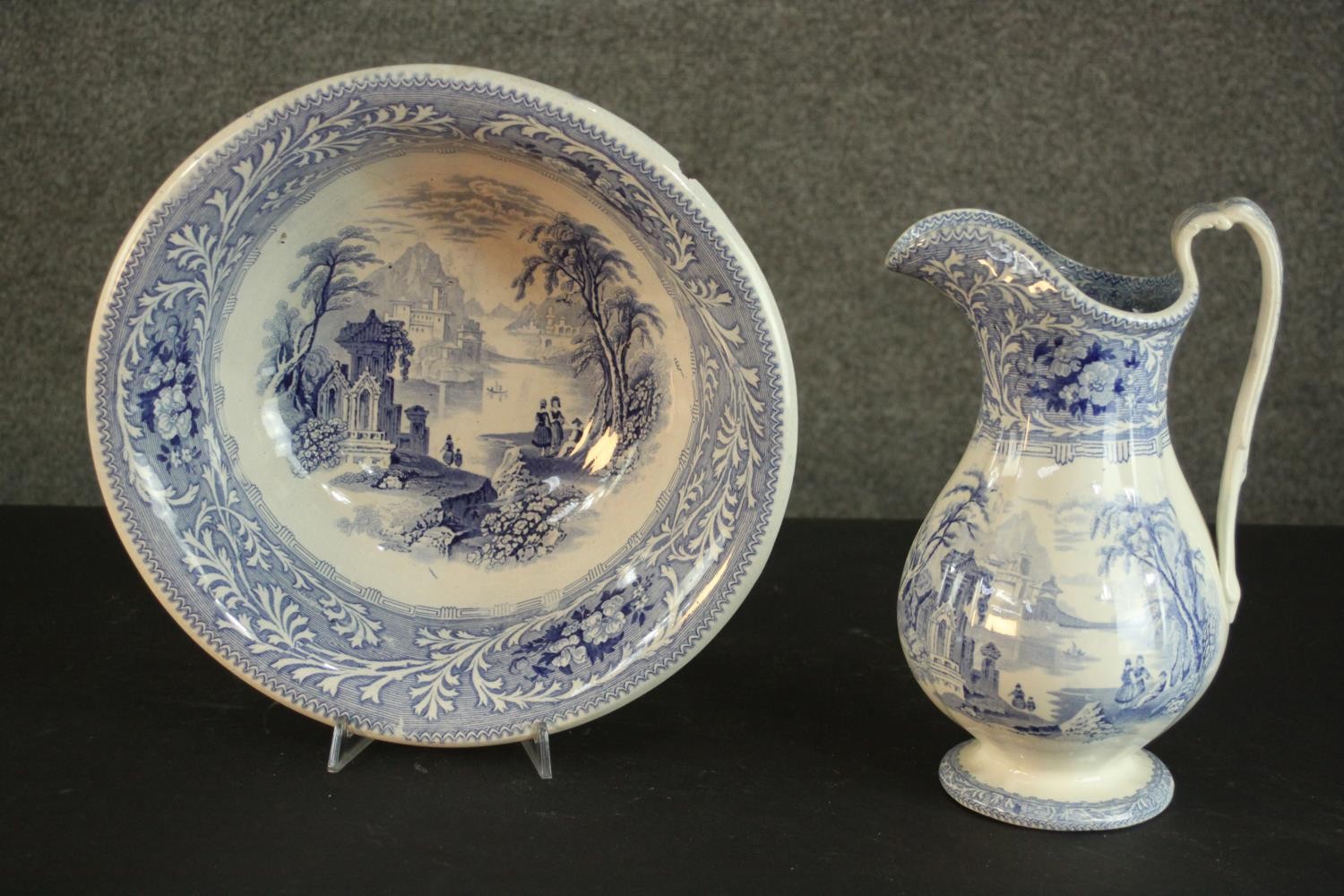 A Victorian Staffordshire blue and white china wash jug and basin, transfer printed with fantastical