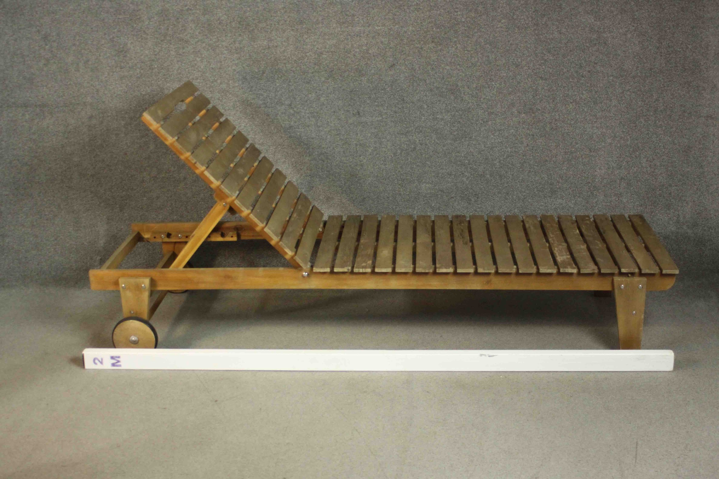 A pair of contemporary teak garden sun loungers of slatted form with adjustable back, on wheels. H. - Image 9 of 9