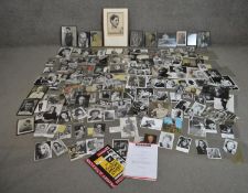 A large collection of black and white photographs of various celebrities, many signed.