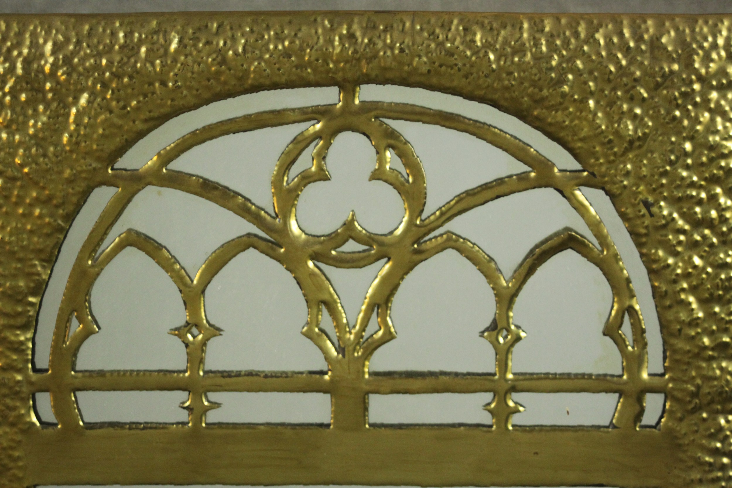 A Gothic Revival/Arts & Crafts planished brass framed mirror with gothic tracery to the rounded arch - Image 3 of 5