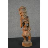 An early 20th century carved African Tribal statue. H.42cm