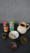 A collection of art pottery along with two hand painted figural design candle sticks. Makers marks