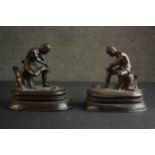 Two 19th century Burmese bronzes, each of a man putting on his sandal mounted on a mahogany base.