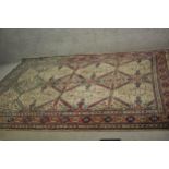 A handmade fawn ground Persian Ardebil carpet. L.300 W.230cm.