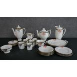 Two Art Deco Royal Doulton hand-painted Tango pattern coffee sets, 29 pieces.