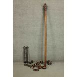 A Victorian fruitwood turned curtain pole with a set of eleven fruit wood curtain rings with white