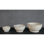 A set of three graduated Victorian acid proof apothecaries pestle and mortars. H.12 Diam.21cm (