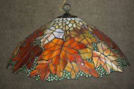 A replica Tiffany style hanging lamp, decorated with maple leaves. L.55 Dia.51cm.