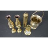 A collection of early 20th century brass ware, including a Turkish Coffee grinder, three candle