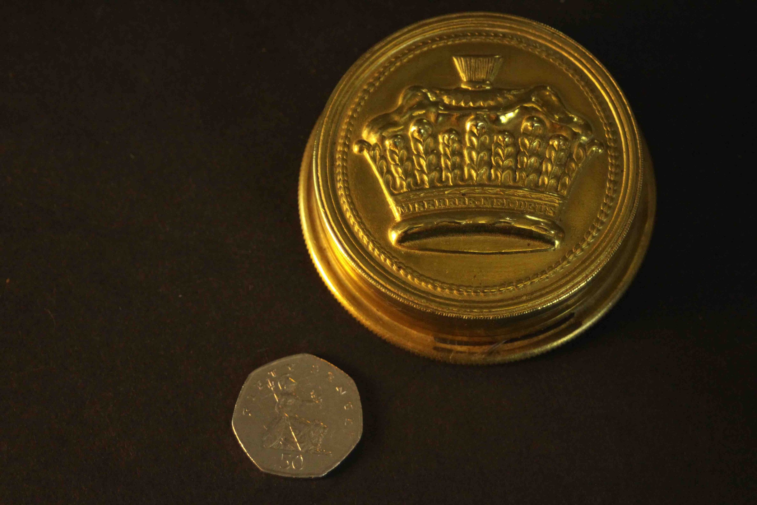 An early 20th century brass embossed box containing an Irish clerical wax seal. H.2.5 Dia.8cm. - Image 2 of 6