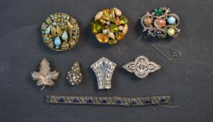 A collection of jewellery including a silver filigree work maple leaf brooch and a French Art Deco