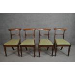 A set of four circa 1830's rosewood bar back dining chairs with green upholstered drop in seats on