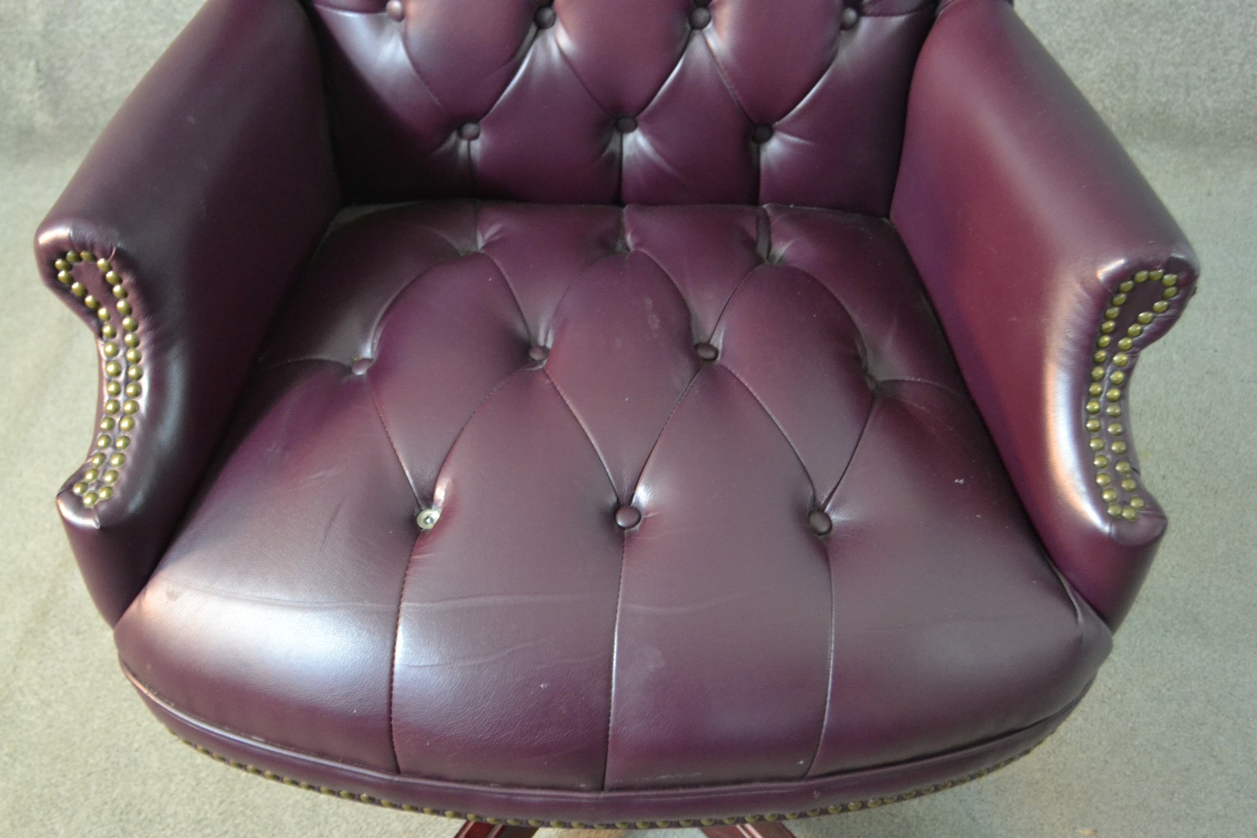 A 20th century wing back swivel office chair, upholstered in burgundy leather, with buttoned back - Image 4 of 13