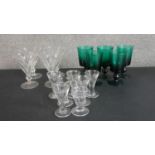 A collection of sixteen 18th and 19th century drinking glasses, including a set of five hand-blown