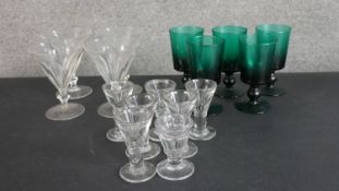 A collection of sixteen 18th and 19th century drinking glasses, including a set of five hand-blown