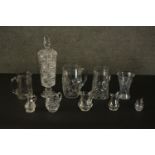 A collection of cut crystal and glass, including a large cut crystal lidded jar, various size jugs