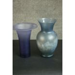Two blue lustre art glass vases one with a trumpeting design. H.29 Dia.15cm.