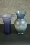 Two blue lustre art glass vases one with a trumpeting design. H.29 Dia.15cm.