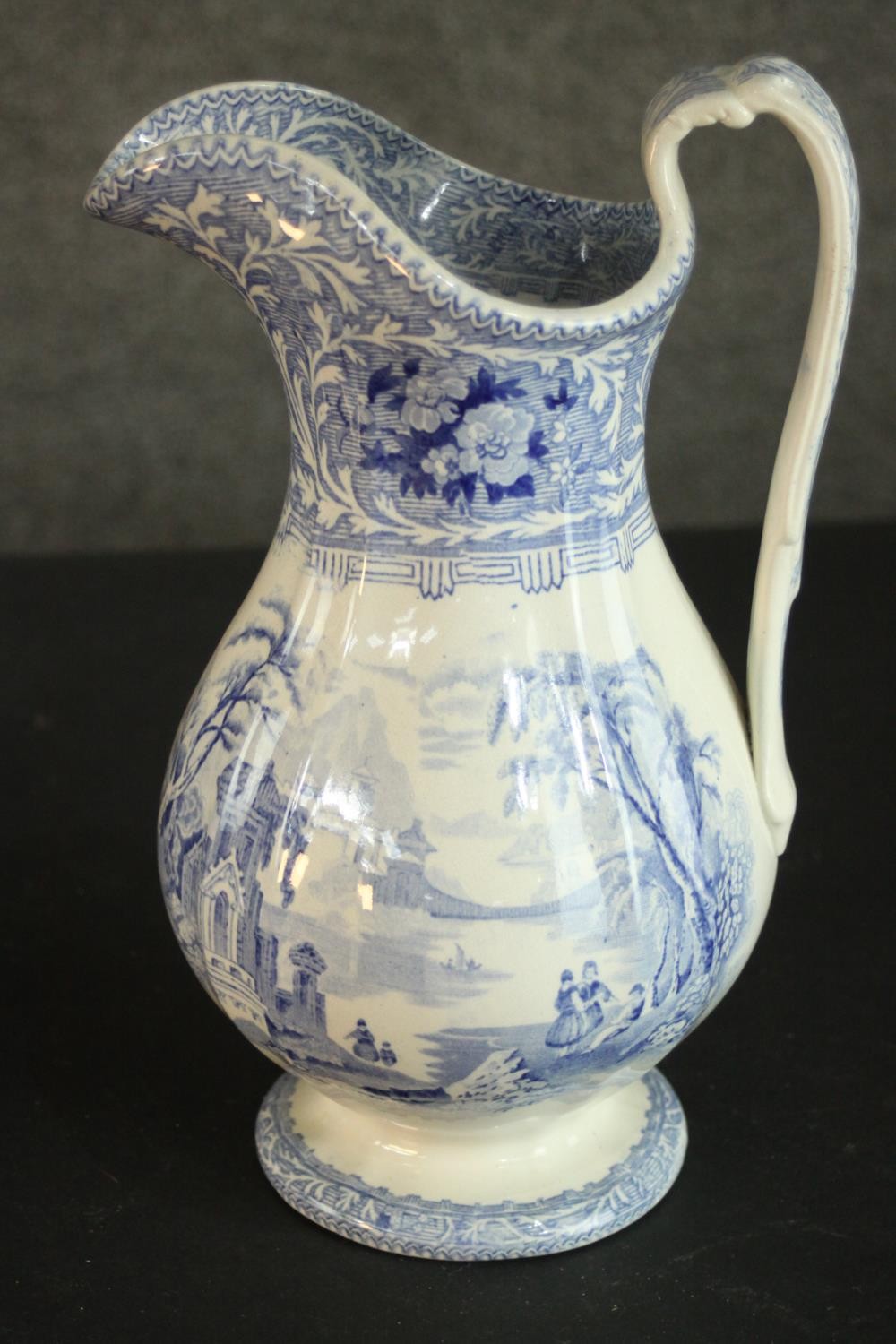 A Victorian Staffordshire blue and white china wash jug and basin, transfer printed with fantastical - Image 4 of 8