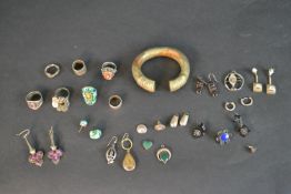 A collection of silver and vintage jewellery including a pair of purple paste set silver earrings, a